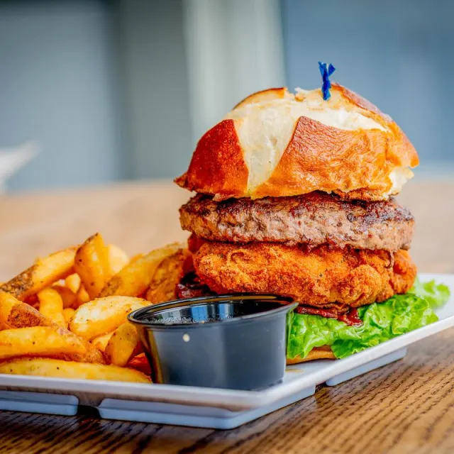 Burger with fries and dipping sauce