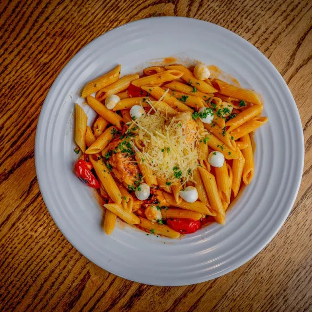 Buffalo chicken pasta on a white plate
